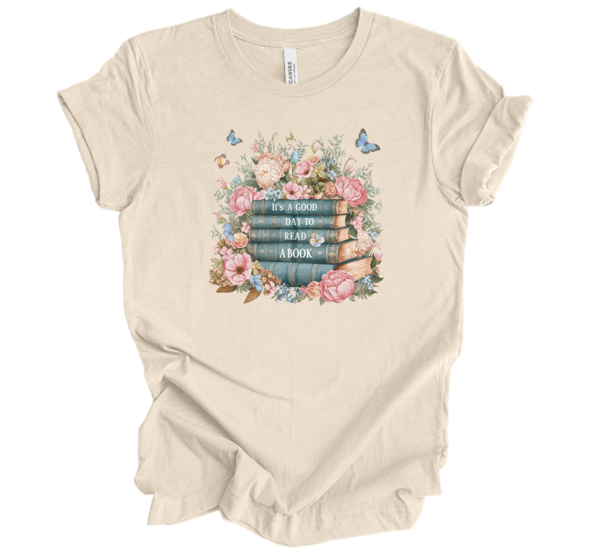 Beige t-shirt with floral and book design

